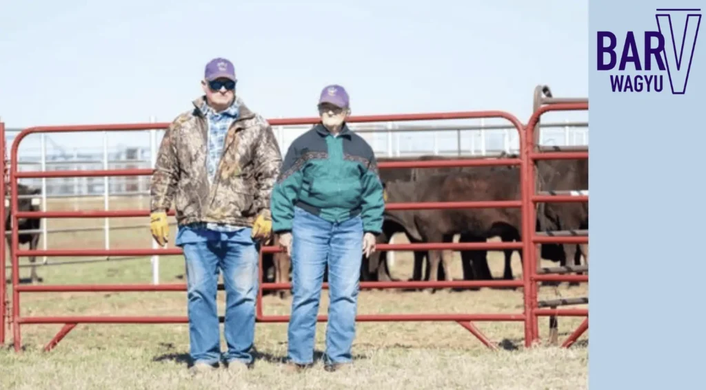 Picture of the Bar V Wagyu owners standing outside a cattle corral